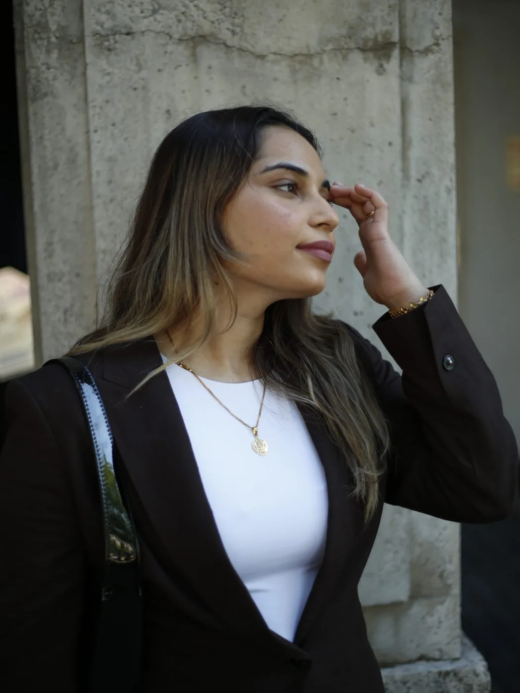 Aanchal Gujral, founder and lead aesthetician of Demure Aesthetics, in a brown blazer